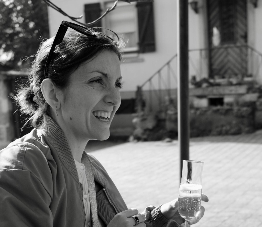 Martha Routen Laughing Portrait with Champagne Glass